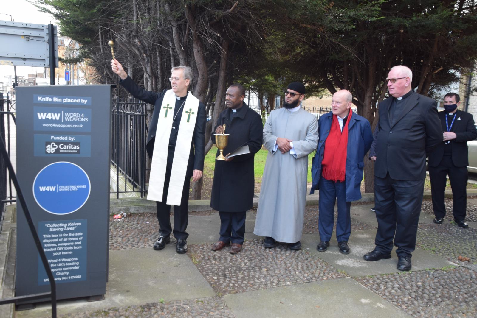 Bishop Hudson blesses new knife bin in Commercial Road - Diocese of Westminster