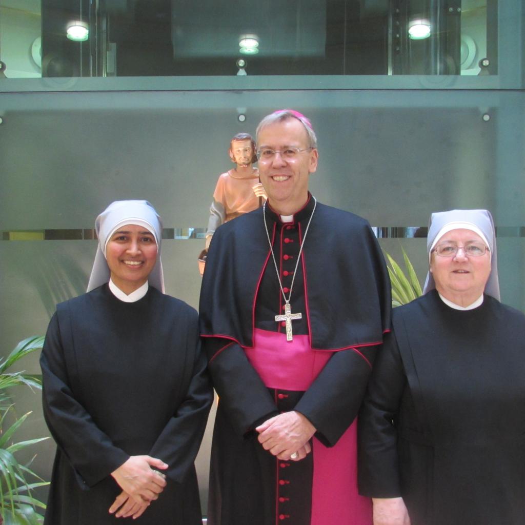 Bishop Nicholas with Little Sisters of the Poor with a statue of St Joseph at St Anne's Home