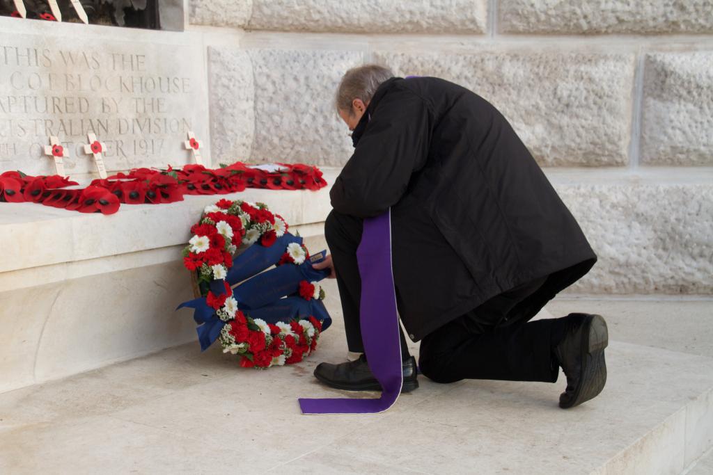 Bishop Nicholas Hudson lays a wreath at Tyne Cot cemetery