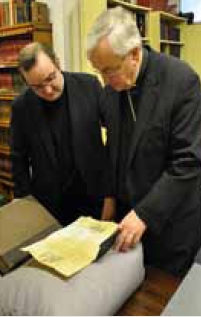 Fr Nicholas Schofield and Archbishop Vincent Nichols look at Blessed John Henry Newman's passport