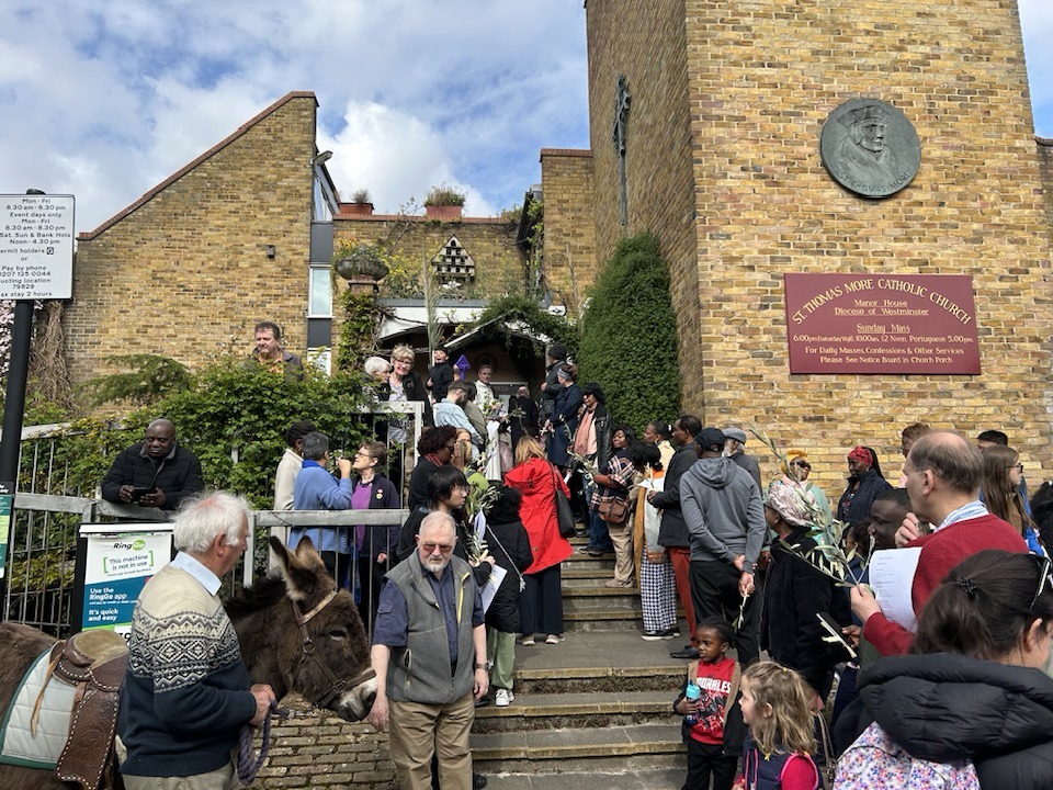 Palm Sunday Ecumenical Procession with donkey draws crowd